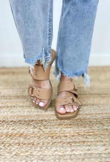 Ennie Nude Sandals, flat nude sandals with two straps and gold hardware detailing on the straps 