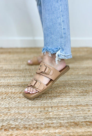 Ennie Nude Sandals, flat nude sandals with two straps and gold hardware detailing on the straps 