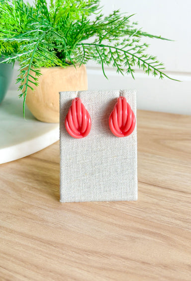 Give Or Take Earrings in Coral, acrylic post back earring with knot detail