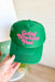 Going Nowhere Fast Trucker Hat in Green, solid green trucker hat with hot pink font "going nowhere fast" on the front