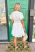 Loving You Is Easy Dress, white short sleeve dress with scoop neck, button detail down the front half of the dress, cinching at the waist and a tier at the bottom of the dress