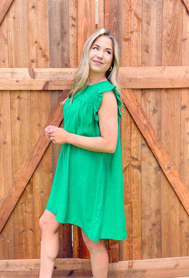 Make A Wish Dress in Kelly Green, ruffle sleeve dress with cinching on the chest in kelly green