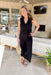 Midnight In London Jumpsuit, black sleeveless wide leg jumpsuit with collar, sailor pocket, and tie detail around the waist