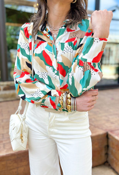 Mixed Signals Button Up Top, long sleeve button down with leaf like pattern in the colors black, white, red, green, aqua, tan, cream, and taupe
