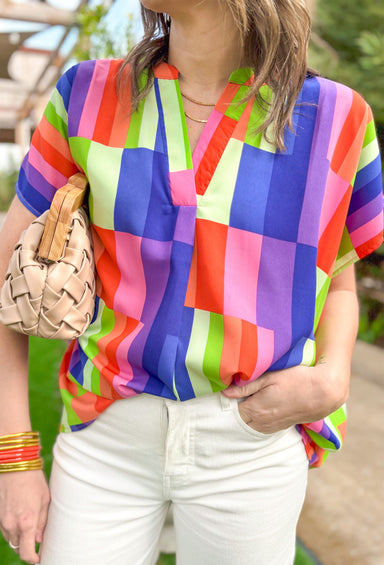 Moving Too Fast Blouse, short sleeve satin blouse with rectangle pattern in colors red, orange, pink, purple, royal blue, lime green, and pale yellow