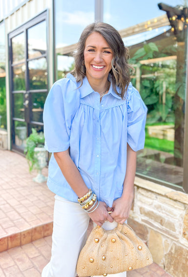 No Doubt Top in Chambray, short puff sleeve button down top with pleating across the chest and ruffle details on top of the shoulders