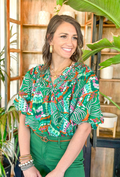 On Second Thought Blouse, green blouse with orange, turquoise, orchid, seafoam, and cream designs