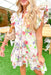 Sound Of Spring Floral Dress, ruffle sleeve button down dress with tiering at the bottom, v-neck, and floral print. White base with purple, light pink, rose, fuchsia, lime, sage, spring green, and pale yellow floral pattern