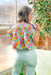 Staying Optimistic Floral Blouse, floral blouse with ruffle sleeves, v-neck, cinching on the chest and the colors orange, pink, light blue, yellow, pale yellow, and baby pink