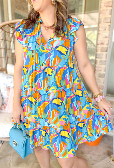 Sunny Forecast Dress, short ruffle sleeve dress with v-neck  and tiering in a flower pattern in the colors cobalt, azure, royal blue, yellow, seafoam, orange, pink, and hot pink