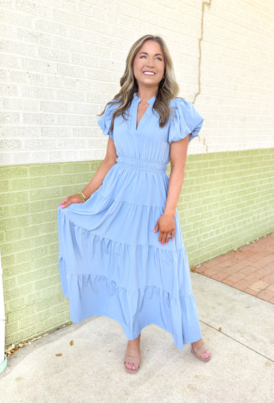 Take It To Heart Midi Dress in Chambray, short puff sleeve midi dress with cinching on the waist, v-neck with ruffling on the neck line, and tiering down the dress