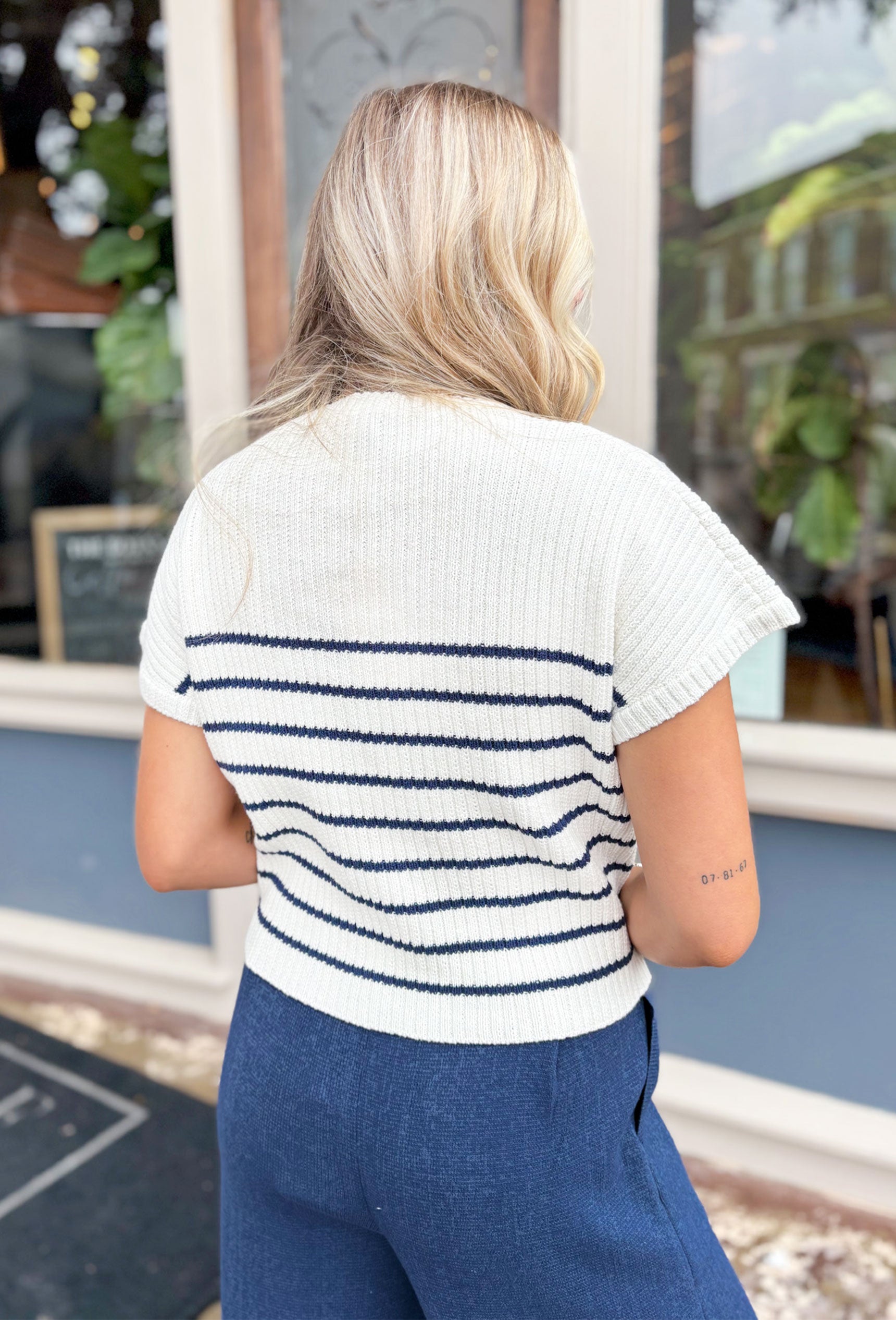 Take The Hint Sweater In Navy, white and navy striped knit short sleeve top with a mock neck 