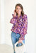 Take Your Chance Blouse, abstract flower long sleeve blouse with cinch and ruffle detailing on the wrists and a slight v-neck