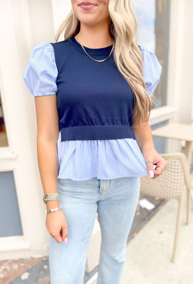 Tell You A Secret Top, short puff sleeve top that is light blue and white pinstripes, cropped navy sweater vest overtop the striped top