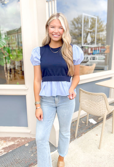 Tell You A Secret Top, short puff sleeve top that is light blue and white pinstripes, cropped navy sweater vest overtop the striped top