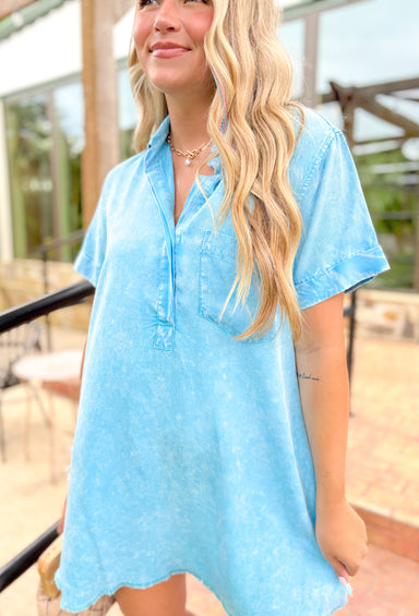 Vacation Is Calling Dress in blue, light weight acid washed bright blue shirt dress with collar, front pocket, and frayed hem