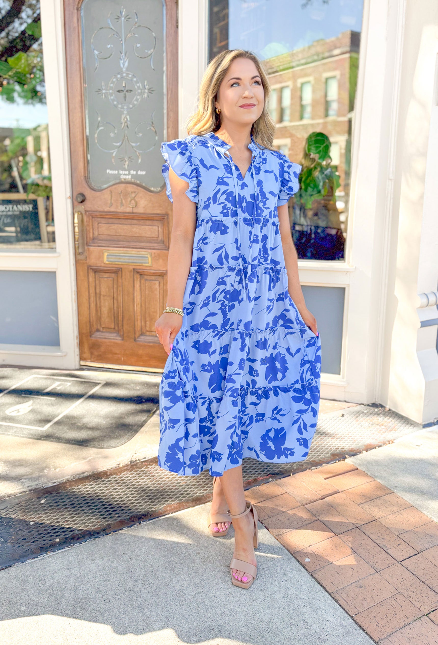 Warmer Weather Floral Midi Dress in Blue, light blue midi dress with dark blue floral printing, ruffling on the sleeves and tiering of the dress, soft v-neck with ruffling on the neck line