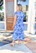 Warmer Weather Floral Midi Dress in Blue, light blue midi dress with dark blue floral printing, ruffling on the sleeves and tiering of the dress, soft v-neck with ruffling on the neck line