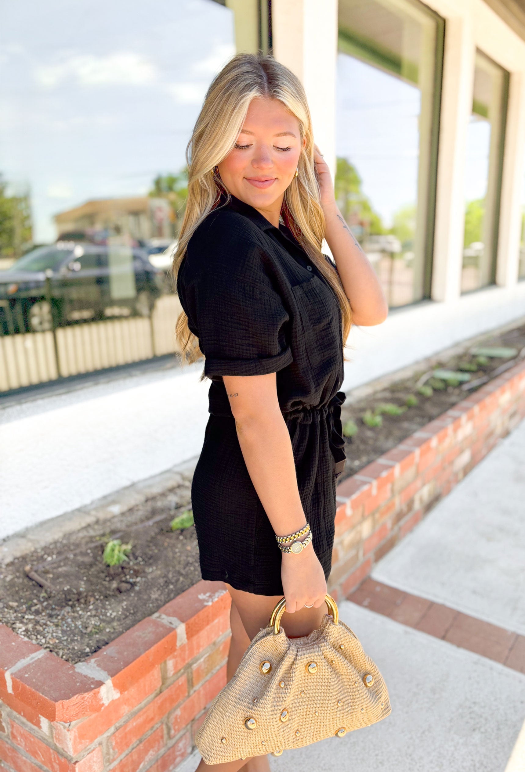 Z SUPPLY Lookout Gauze Romper, black gauze short sleeve button down romper with drawstring around the waist, rolled sleeves, front pockets on the chest and pockets at the waist
