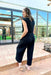 Z SUPPLY Lunch Date Pucker Jumpsuit, short sleeve black textured jumpsuit with soft v-neck, wide legs. and elastic waist band