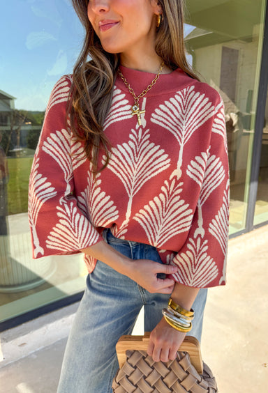 Add a cozy dose of fall charm to your wardrobe with this rose clay sweater featuring a soft cream abstract print. The lightweight knit makes it an easy transitional piece, while the playful pattern adds just the right amount of charm. Whether you’re headed to brunch or a casual night out, this one will become an instant favorite!