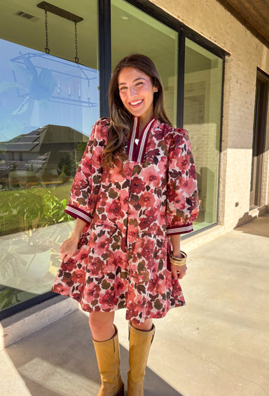 This floral dress by Entro is the perfect mix of playful and polished. Designed in rich shades of wine, it features puff sleeves and a striped trim collar and cuffs that add a sporty yet feminine touch. The patch pockets at the front bring in a bit of practicality, while the soft cotton fabric and full lining keep it comfortable and easy to wear. A fun fall piece that transitions seamlessly from weekday wear to weekend outings.