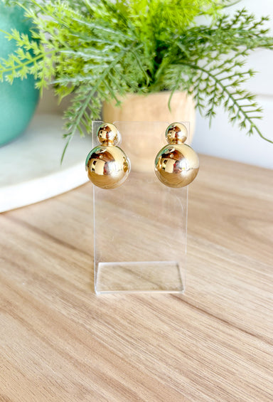 Bad Habit Earrings in Gold, stacked gold spheres top one is smaller than the bottom one 