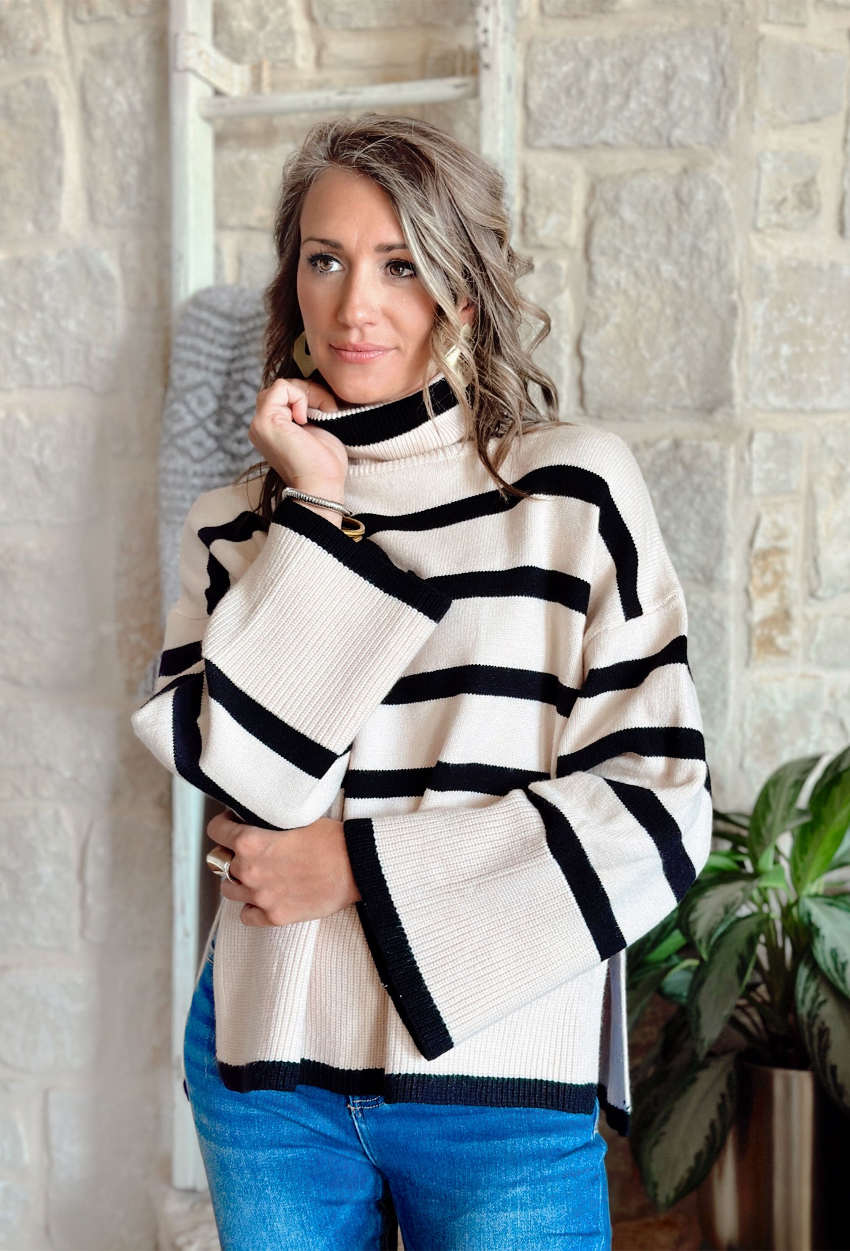 Cider in Soho Sweater, black and cream striped turtle neck sweater with wide sleeves and slits on the sides
