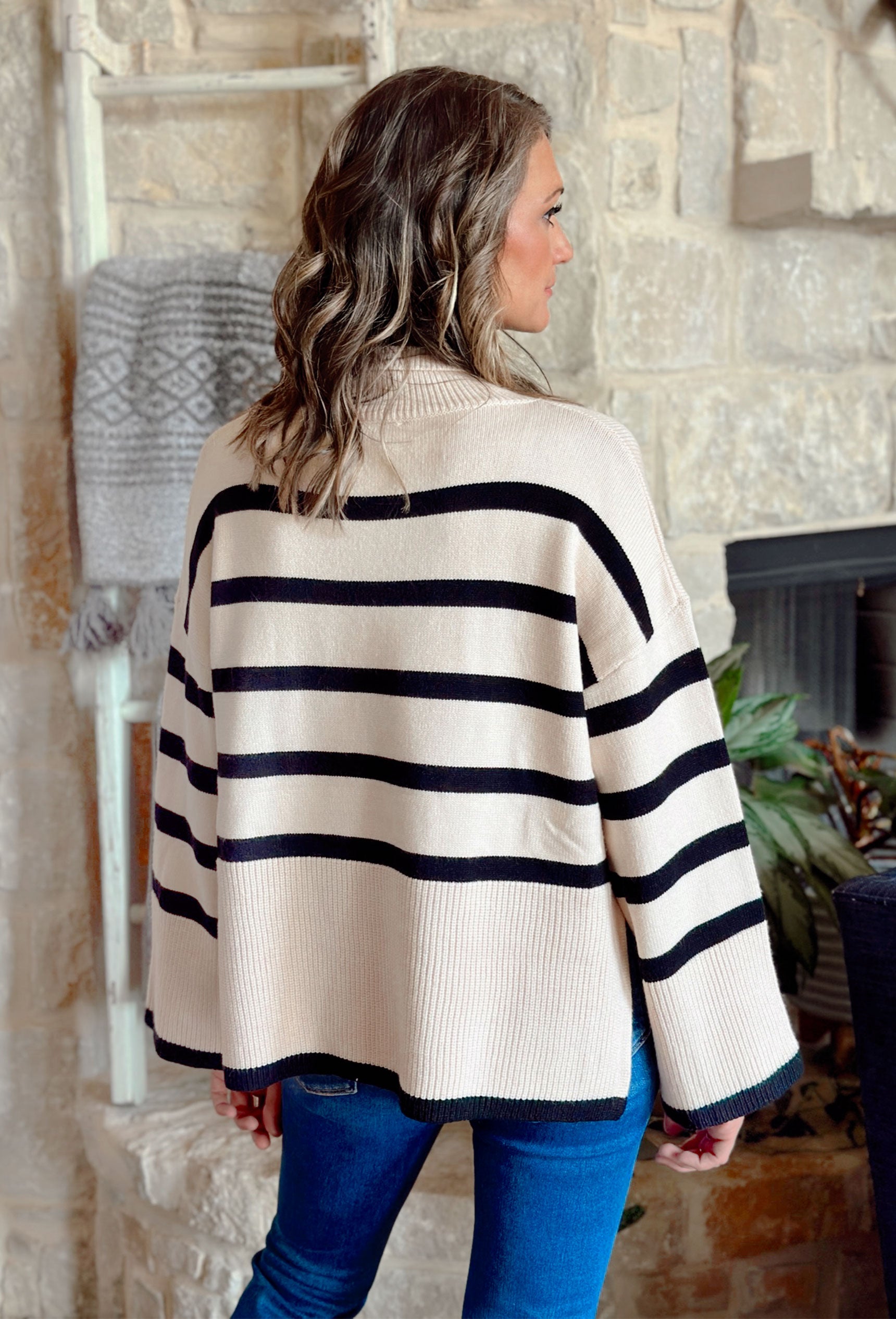 Cider in Soho Sweater, black and cream striped turtle neck sweater with wide sleeves and slits on the sides