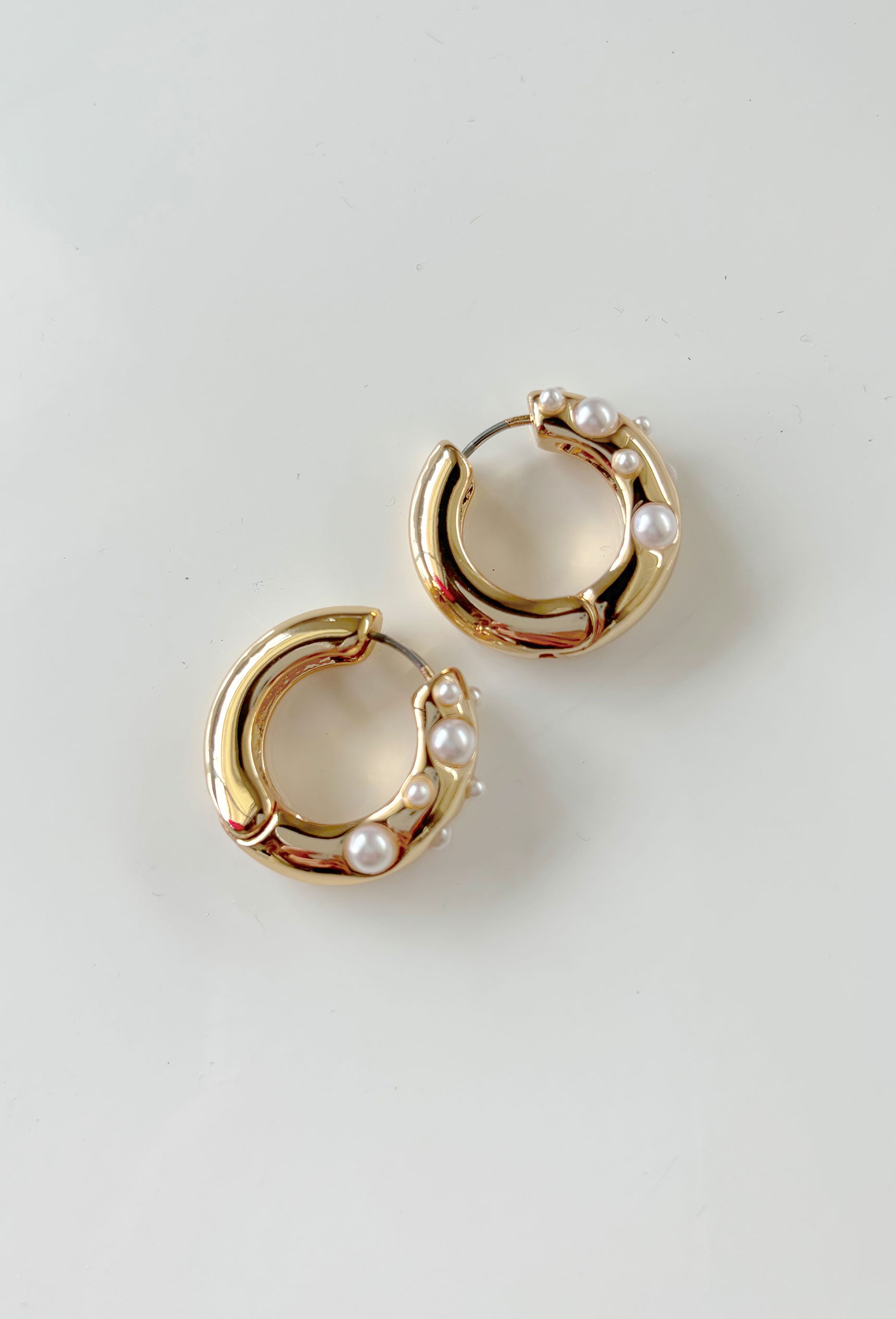 Dusk To Dawn Huggie Earrings, gold huggie with pearl detailing 