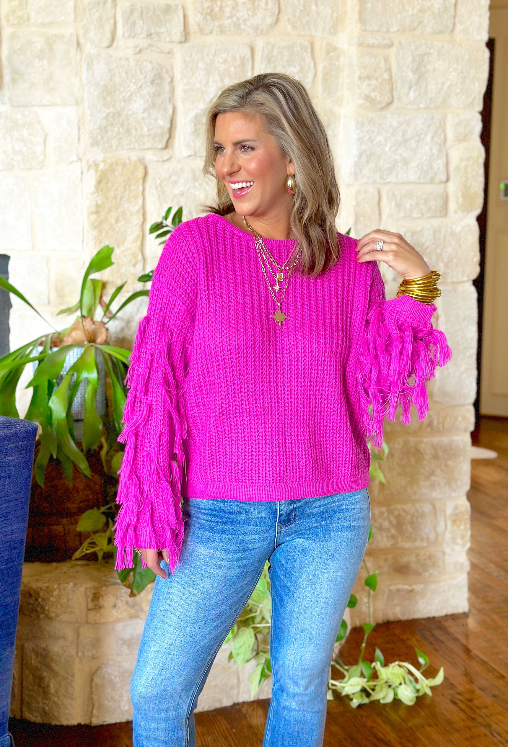 Eiffel Tower Flurries Sweater, bright magenta sweater with frayed tassels on the sleeves