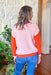 Fall In The City Sweater, colorblock knit sweater with pale pink body, orange sleeves, pale pink wrist, hot pink neckline and orange hem