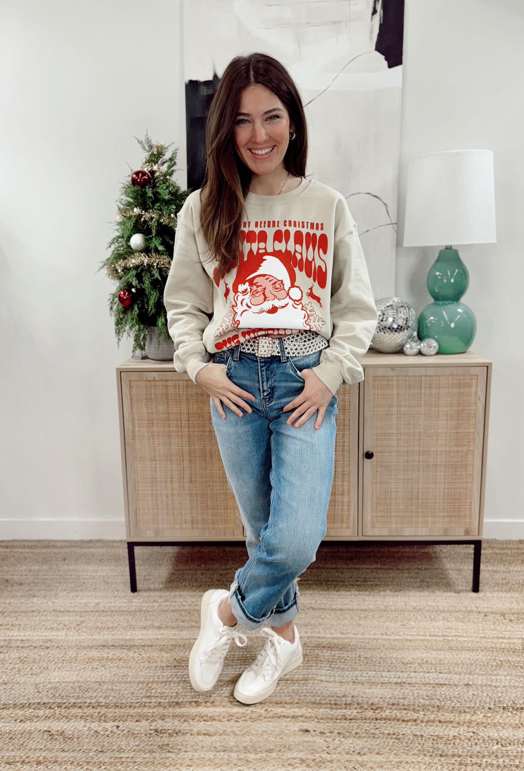 Friday + Saturday: Santa World Tour Sweatshirt, tan crewneck with red and white santa graphic that says "the night before christmas santa clause the world tour"