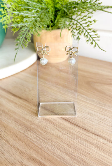 Here With Me Earrings, small textured gold bow post back earrings with pearl attached to the bottom 