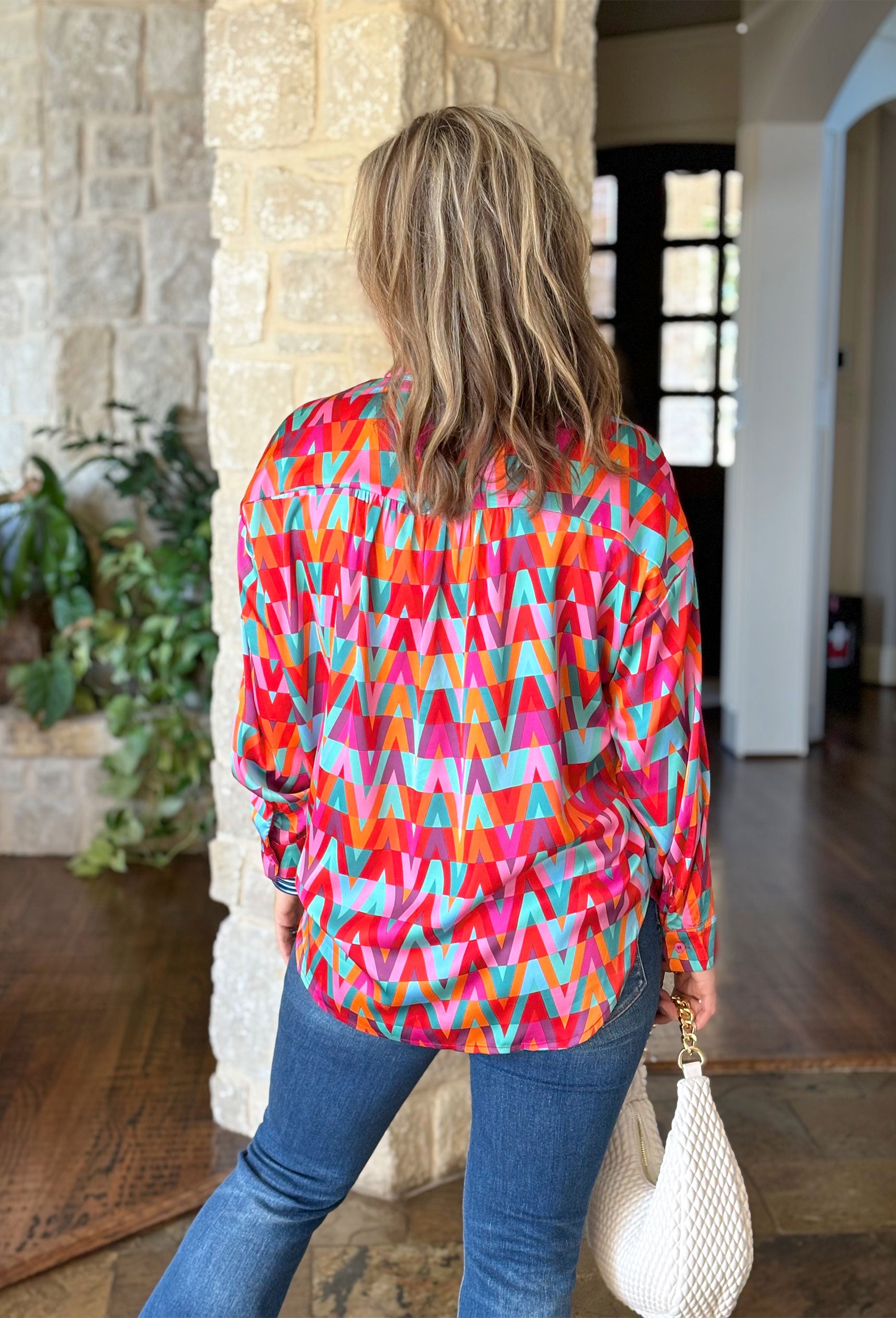 Live In The Moment Top, triangle patterned long sleeve button up blouse in the colors turquoise, red, orange, teal, purple and pink 