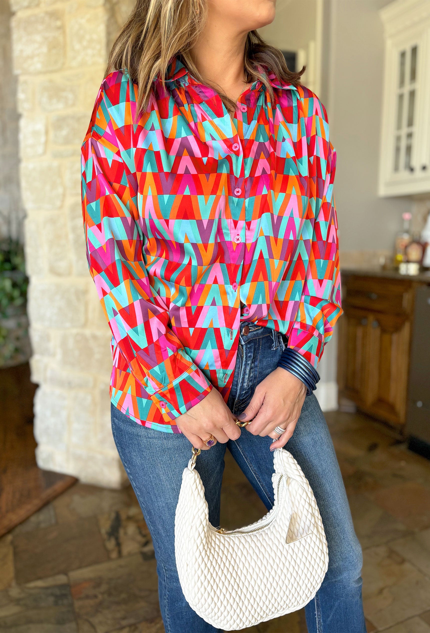 Live In The Moment Top, triangle patterned long sleeve button up blouse in the colors turquoise, red, orange, teal, purple and pink 