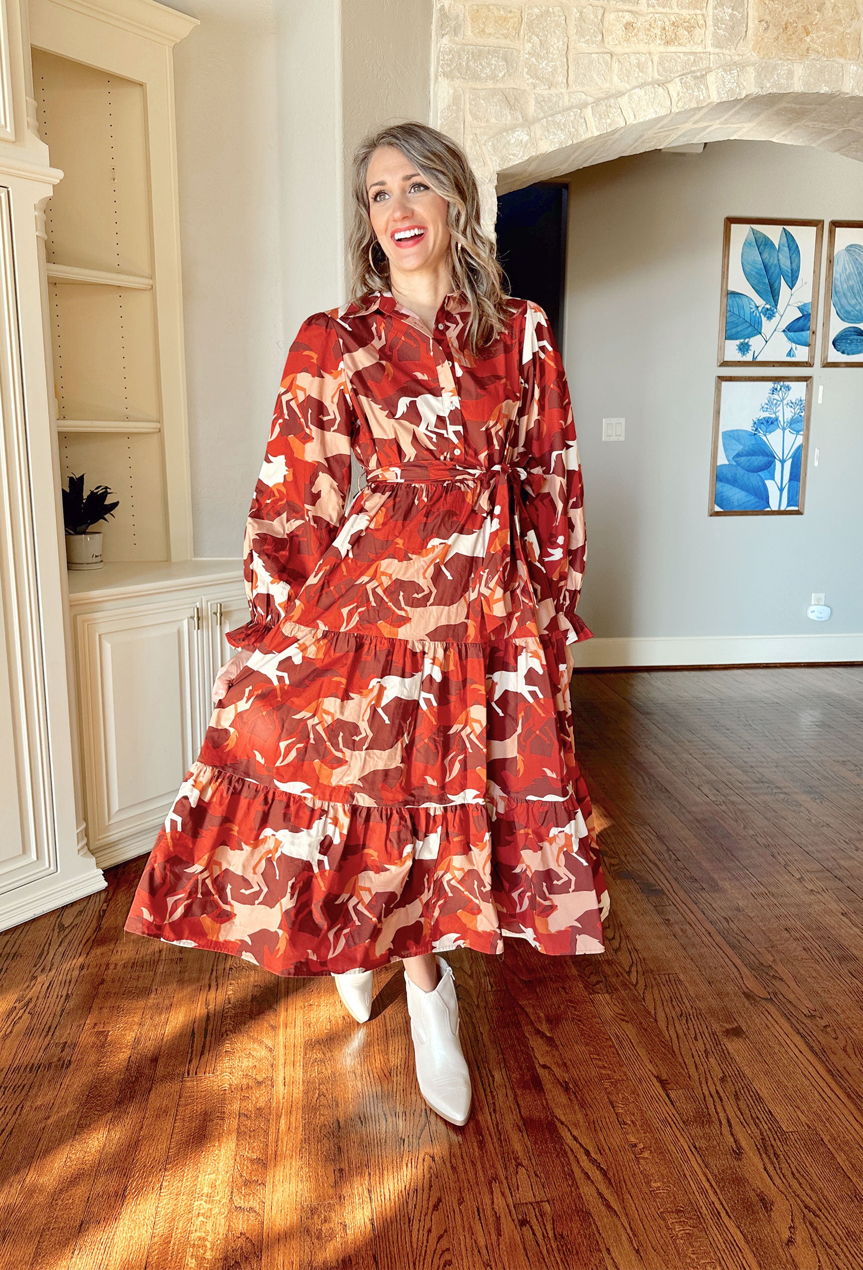 Not My First Rodeo Midi Dress, burnt orange, burgundy, red, cream, and pale orange long sleeve midi dress with horses printed on it, quarter length button up and tie waist 