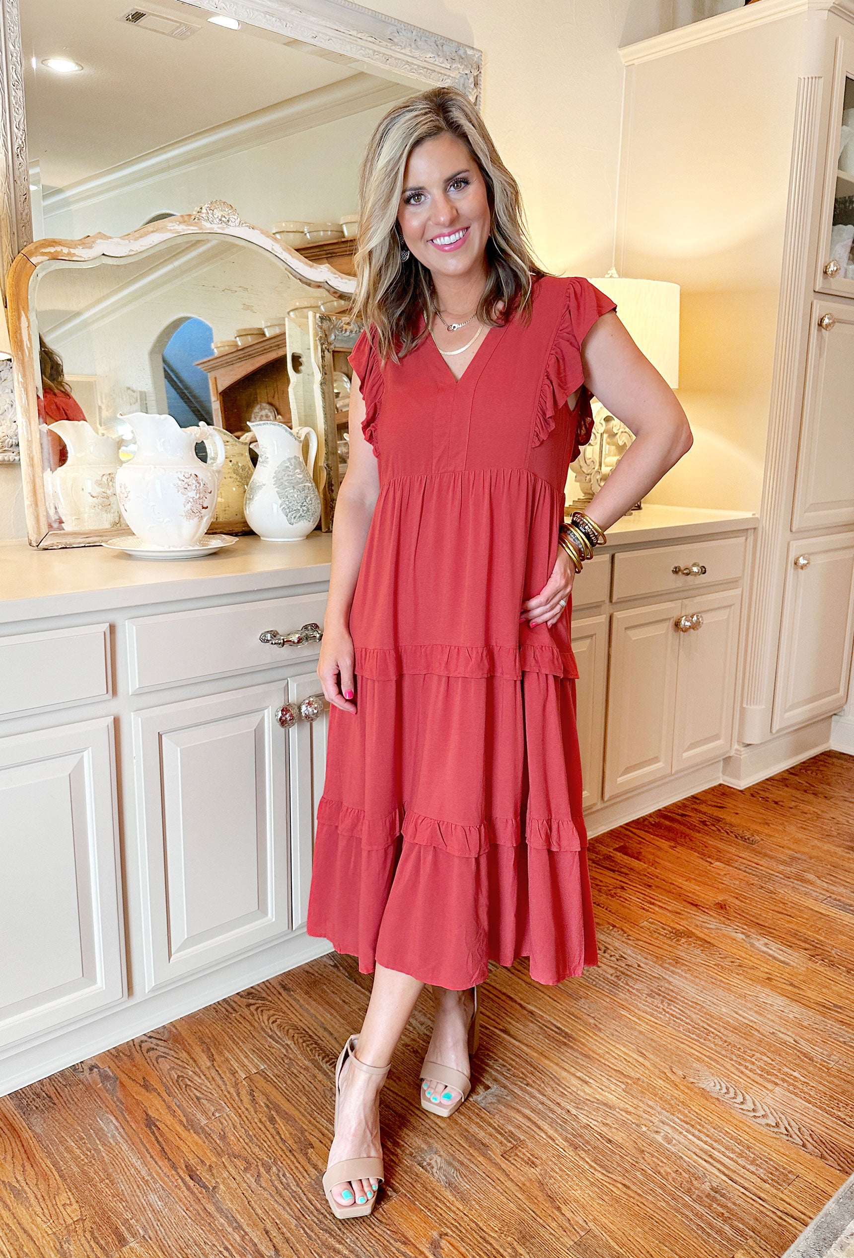 Paige Midi Dress in Rust, Rust/terracotta tiered midi dress with ruffles at each tier, v-neck detail with ruffled sleeves