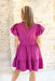 Park Avenue Dress in Plum, magenta puff sleeve v-neck dress with cinching at the waist and tiering.