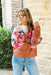 Smell The Flowers Sweater, burnt orange and cream sweater with pink and mauve flowers and green leaves