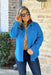 Snow Angel Jacket, electric blue wool blend coat with snap buttons and two front pockets on the chest