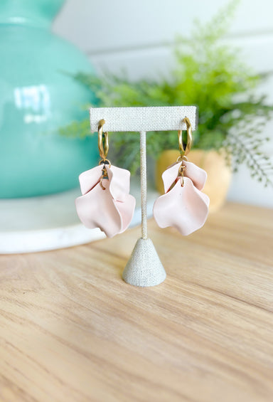 Up To You Earrings, matte gold hoop earrings with clay petals hanging off the bottom 