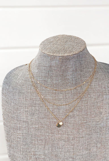 Amaya Layered Necklace, 3 strand gold necklace with 2 coin pendants on the longest strand 