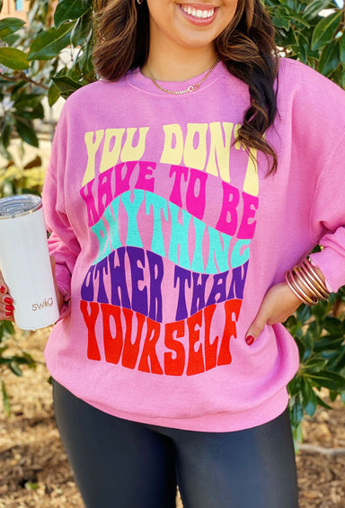 Be Yourself Graphic Pullover, pink pullover with rainbow words that say "you don't have to be anything other than yourself"