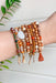 California Coast Beaded Bracelet Set, set of 10 bracelets, orange, gold and white beads, charms and tassels hanging