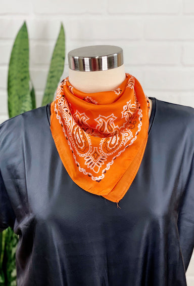 Charlee Bandana Neck Scarf in Orange, orange colored bandana, with white and black design