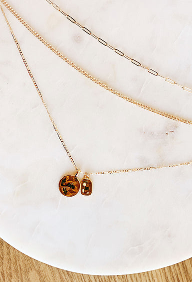 Columbus Coin & Charm Necklace, the necklaces layered with hammered coin charm, lobster clasps