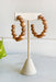 Ella Hoop Earrings in Nude, hoop earrings with tan wood and sparkly gold beads in a hoop shape