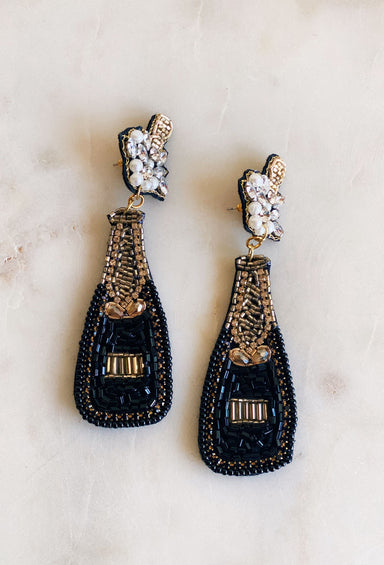 Endless Nights Bottle Beaded Earrings, black and gold beads in the shape of a champagne bottle, cork popping off, post backing