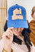 Judth March Girl Mom Hat, Blue and tan trucker hat decorated with "Girl Mom" soft pink patch outlined in gold glitter, and subtle distressing with scratch detail